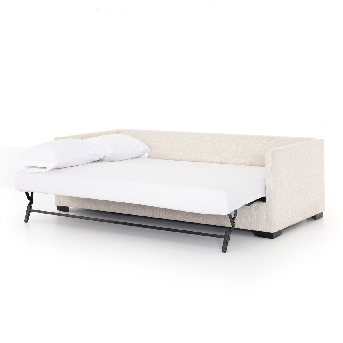 Four Hands Wickham Sofa Bed in Alameda Snow with the bed unfolded on a white background