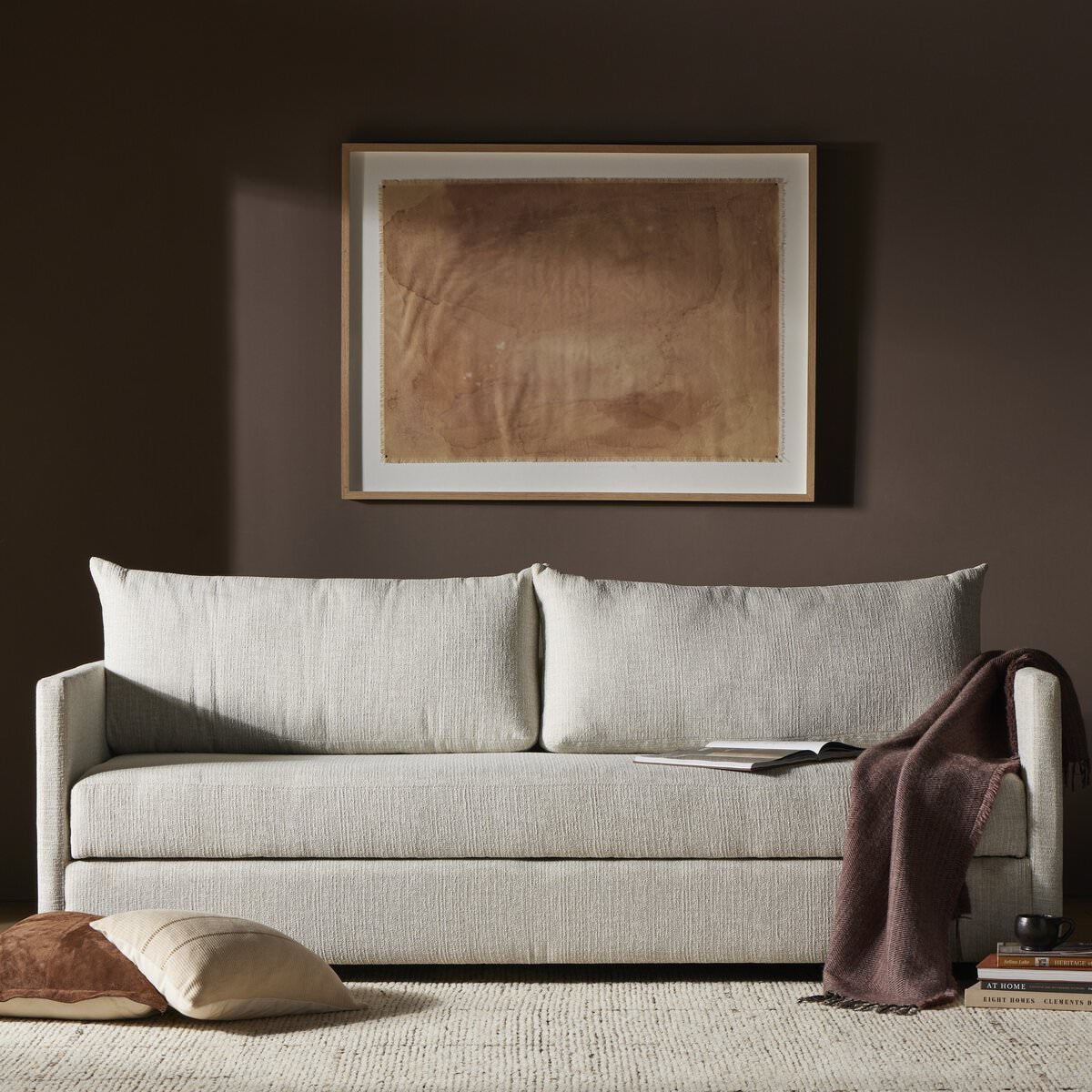 Four Hands Wickham Sofa Bed in Alameda Snow in a dark neutral room