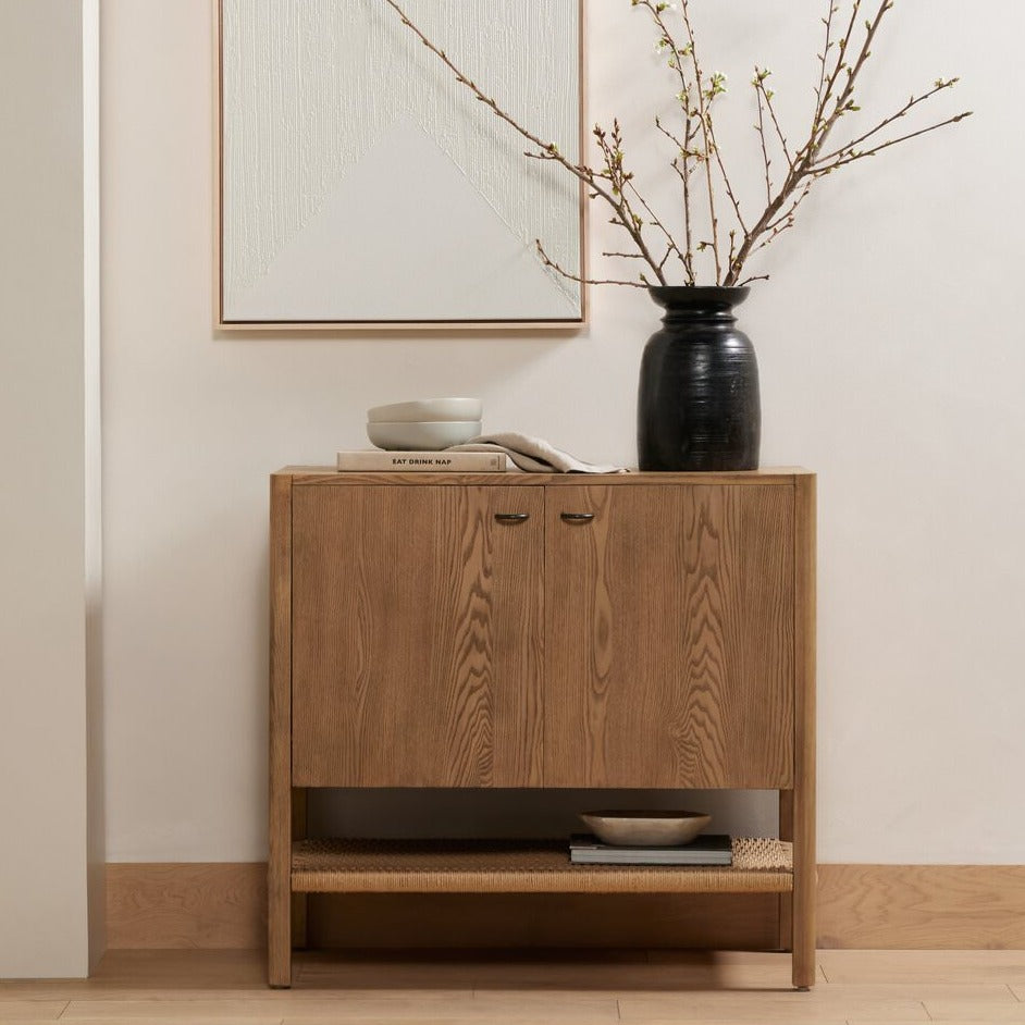 Four Hands Zuma Small Cabinet in Dune Ash in a neutral room