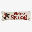 Hand Hooked Pillow that says gone skiing on a white background