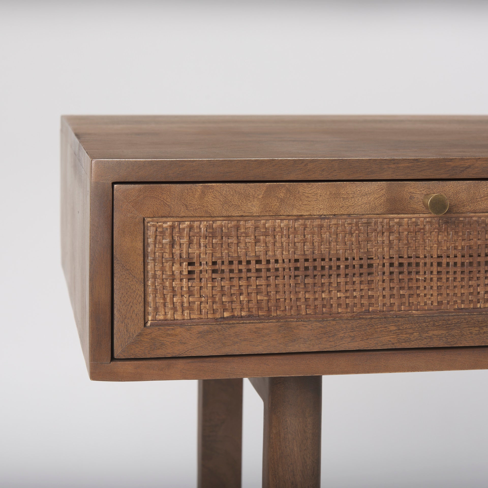 Close up of Grier Medium Brown Solid Wood with Cane Office Desk on a white background