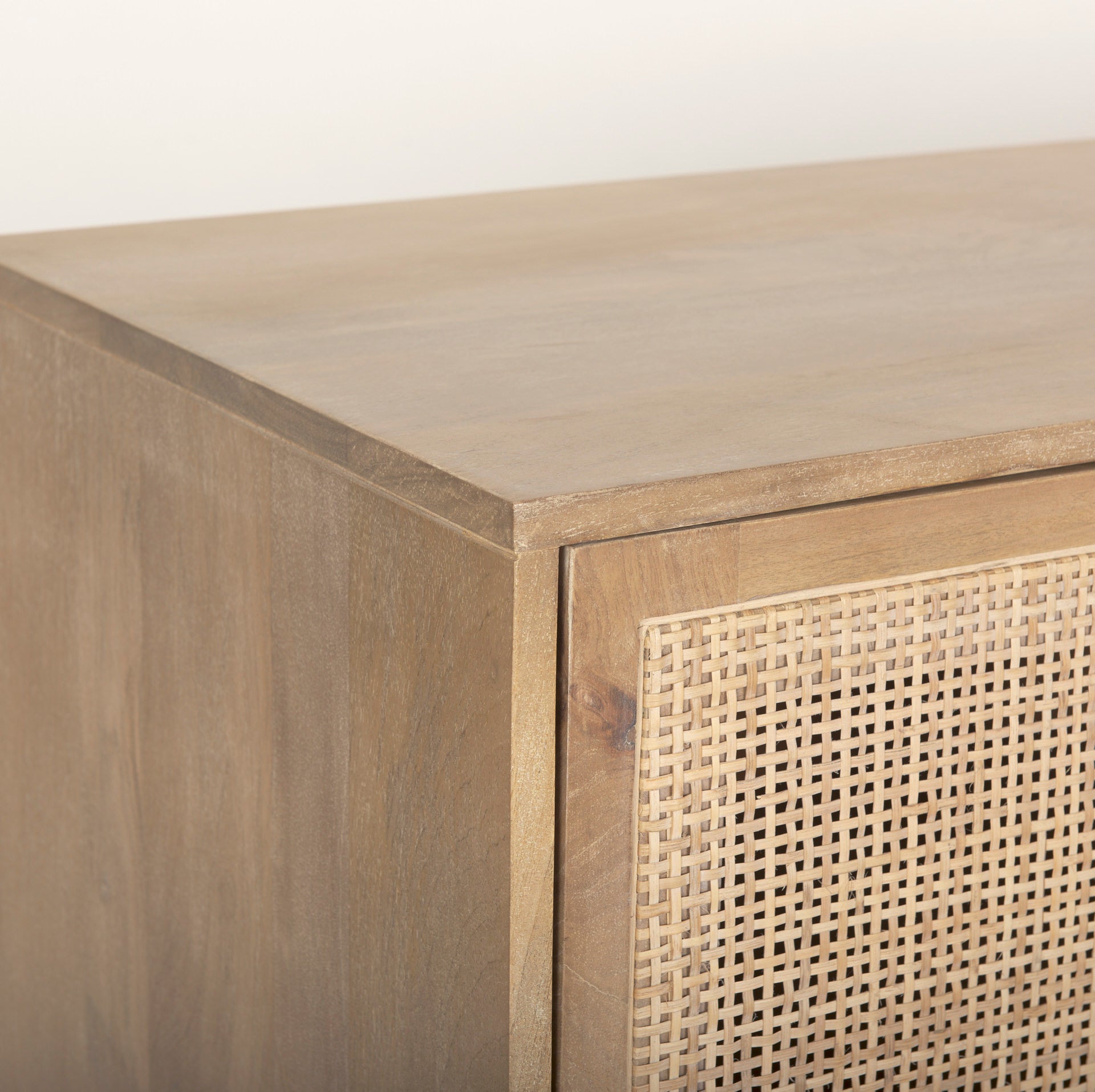 Close up of Grier Light Brown Solid Wood with Cane Sideboard on a white background