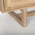 Close up of Grier Light Brown Solid Wood with Cane Sideboard on a white background