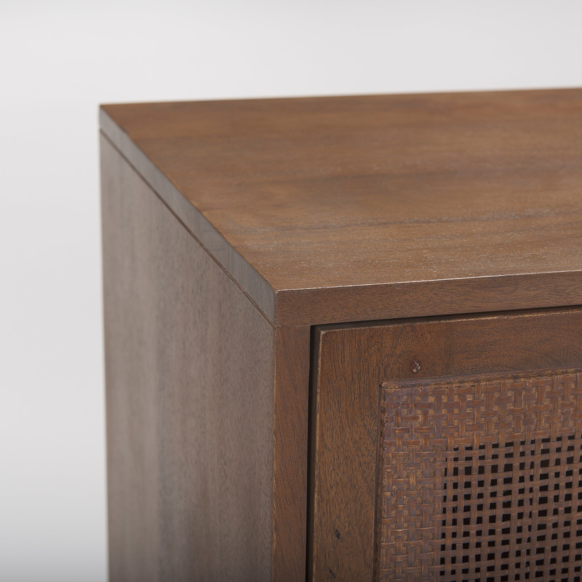 Close up of Grier Medium Brown Solid Wood with Cane Sideboard on a white background