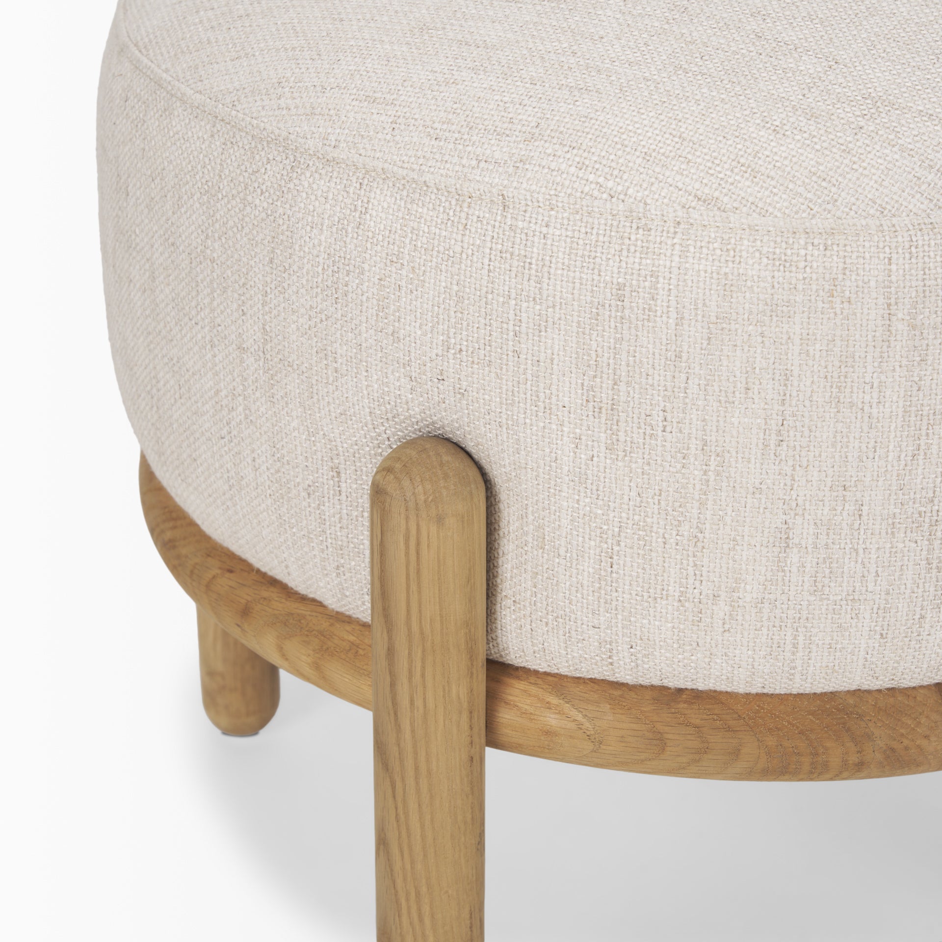 Close up of Gwynn Beige Fabric with Light Brown Wood Pouf on a white background