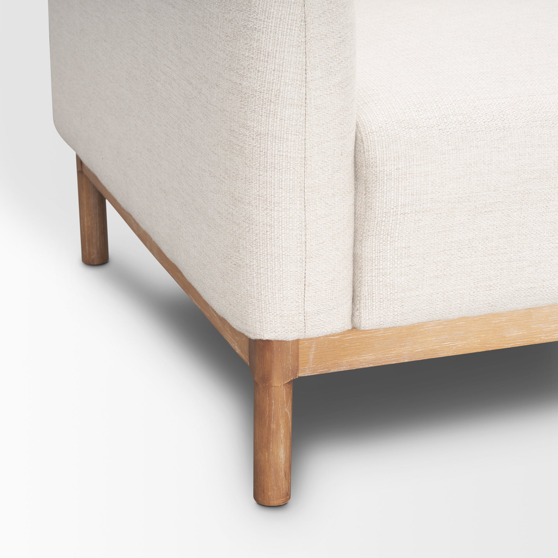 Close up of Hale Sofa W/ Medium Brown Wood and Oatmeal Fabric on a white background