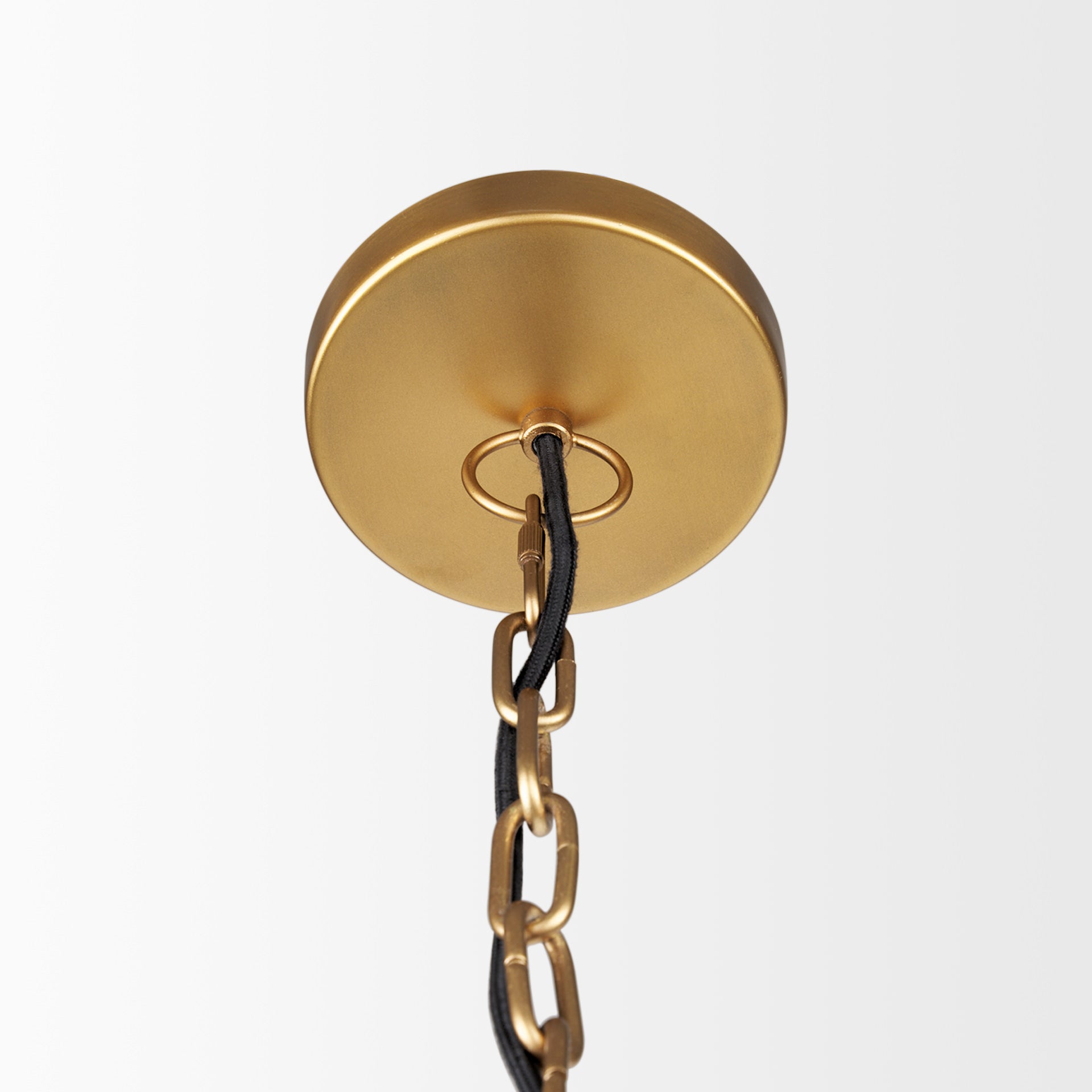 Close up of Karina 24" Round Brass-tone Hammered Metal Dome Pendant Light on a white background