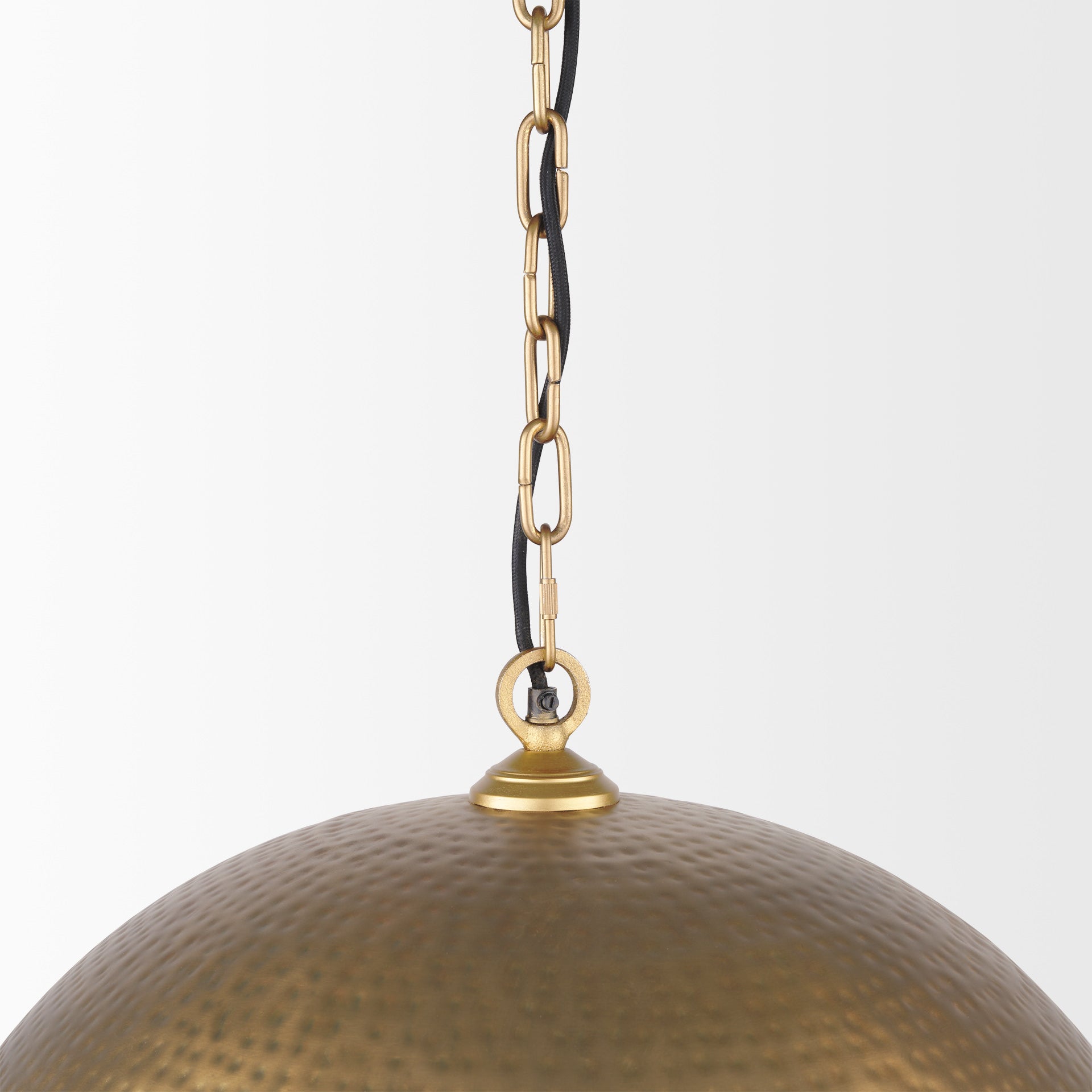 Close up of Karina 24" Round Brass-tone Hammered Metal Dome Pendant Light on a white background