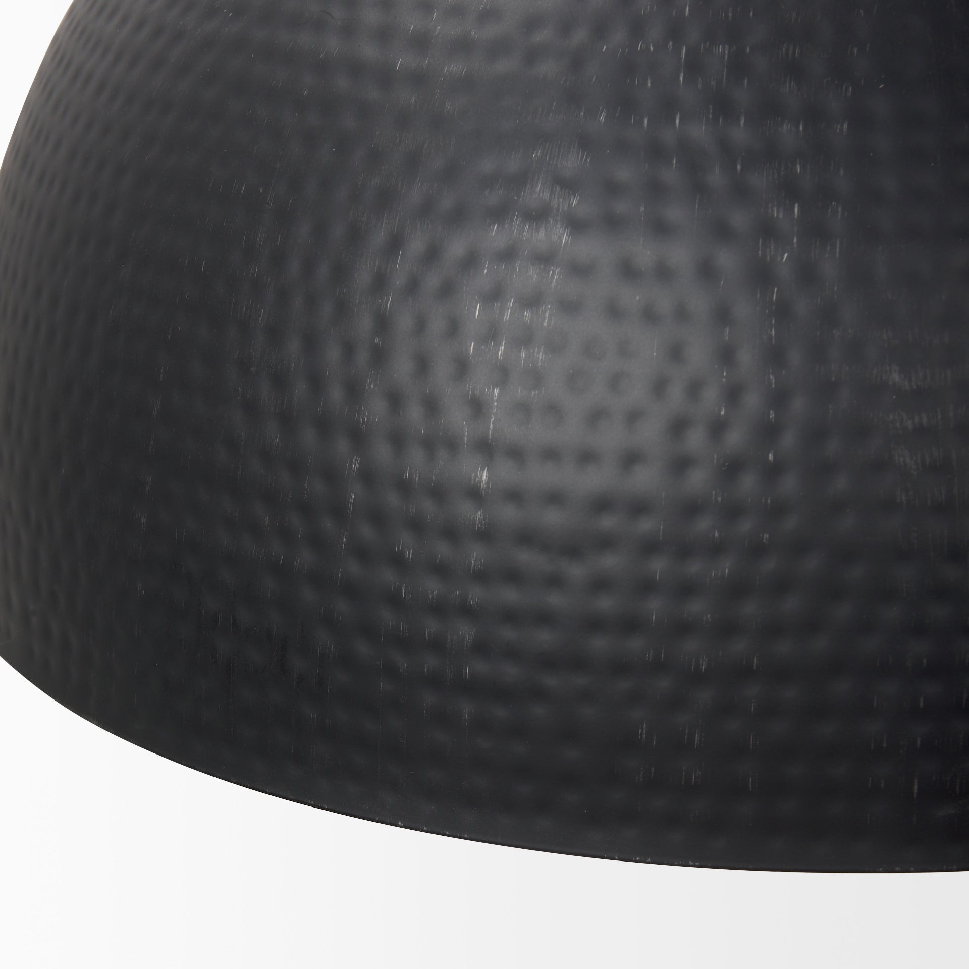 Close up of Karina 24" Round Matte Black Hammered Metal Dome Pendant Light on a white background