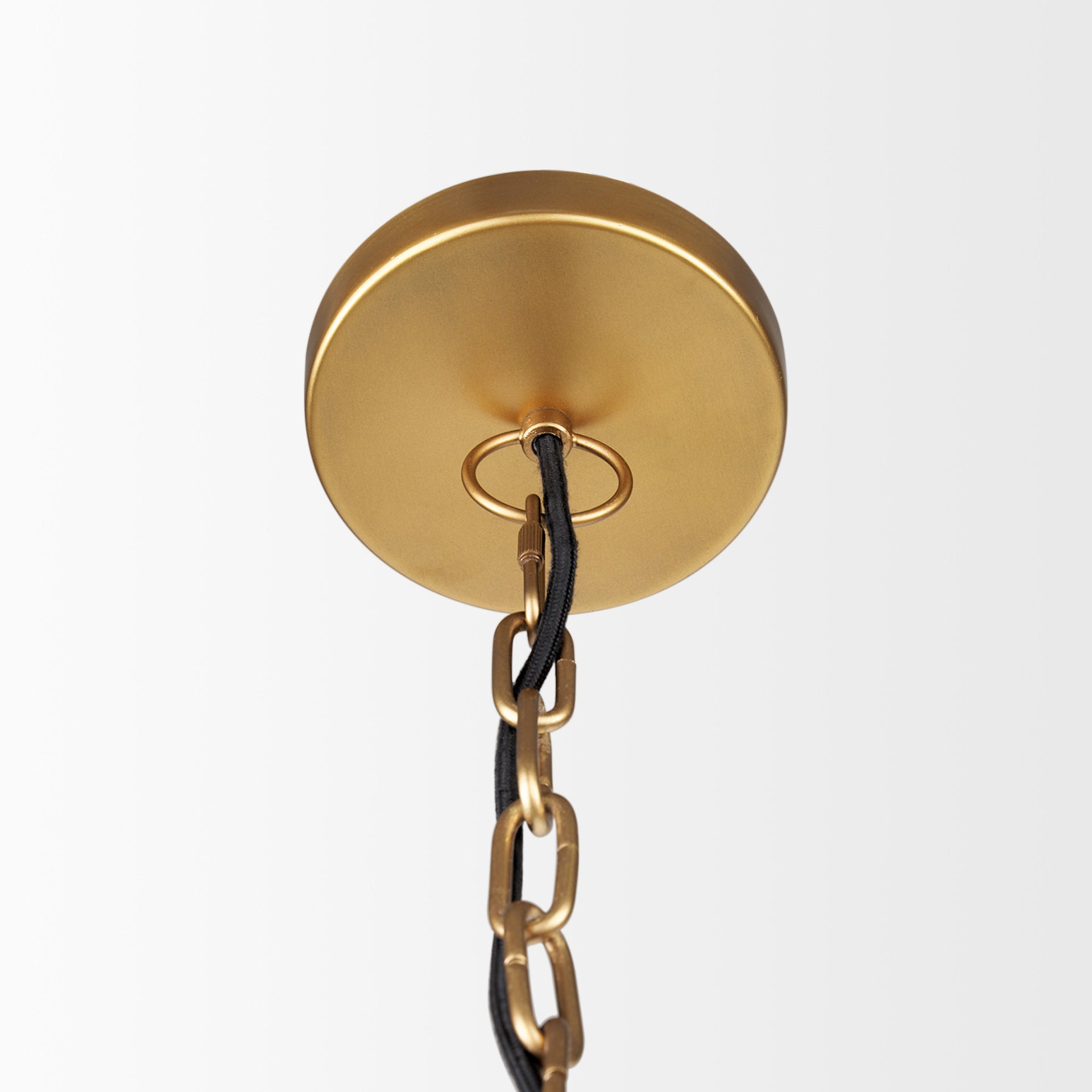 Close up of Karina 36" Round Brass-tone Hammered Metal Dome Pendant Light on a white background