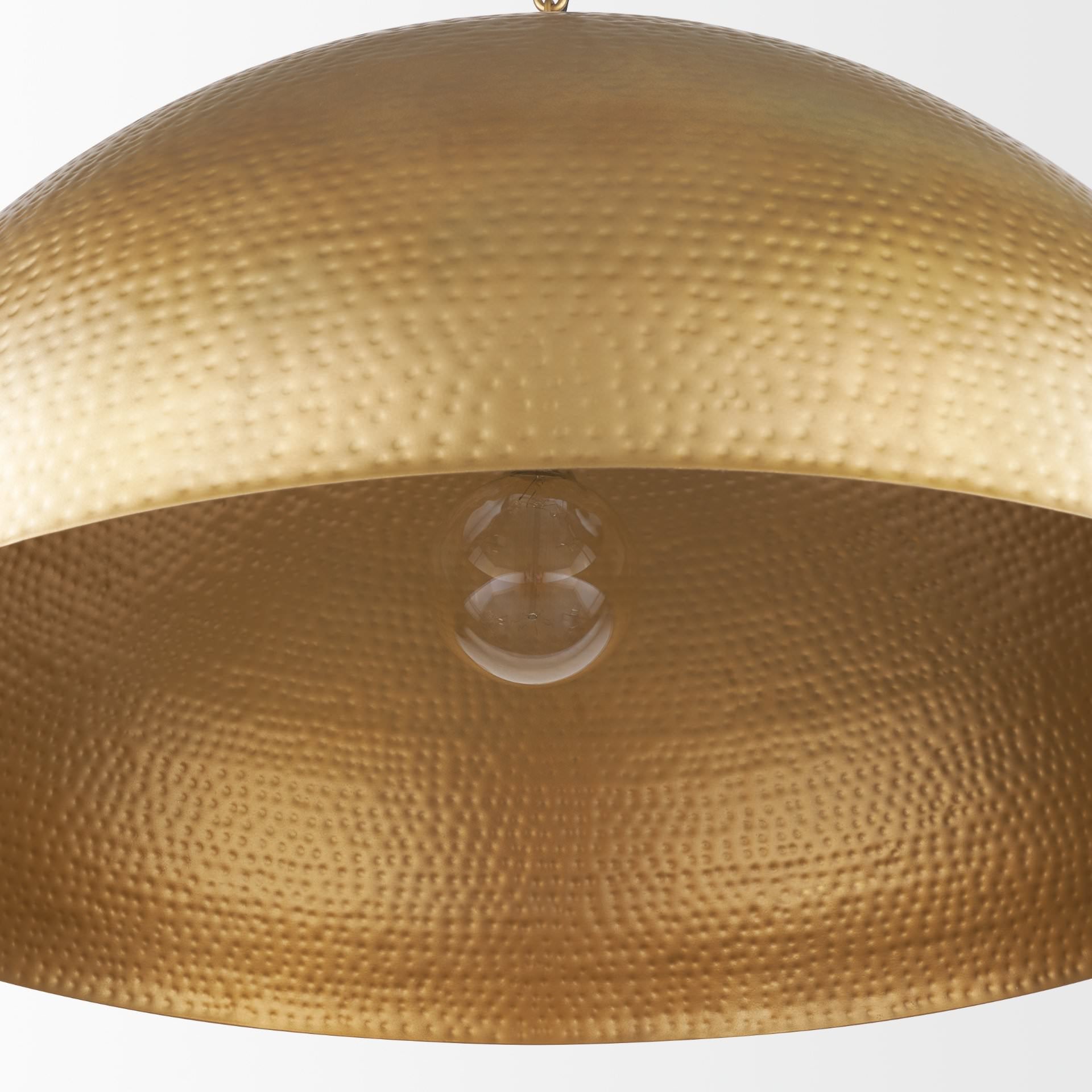 Close up of Karina 36" Round Brass-tone Hammered Metal Dome Pendant Light on a white background