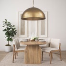 Karina 36" Round Brass-tone Hammered Metal Dome Pendant Light in a modern farmhouse dining room