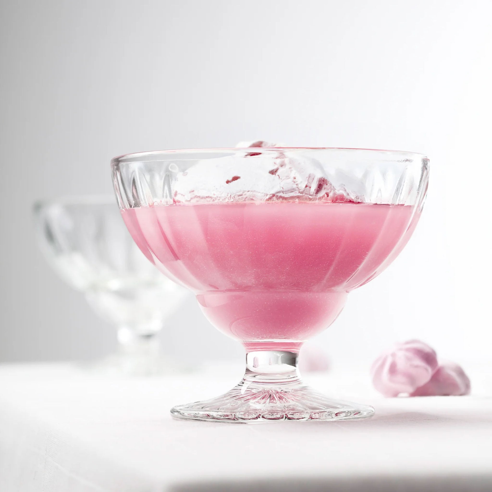 La Rochere Elise Ice Cream Dish filled with a pink beverage on a white background