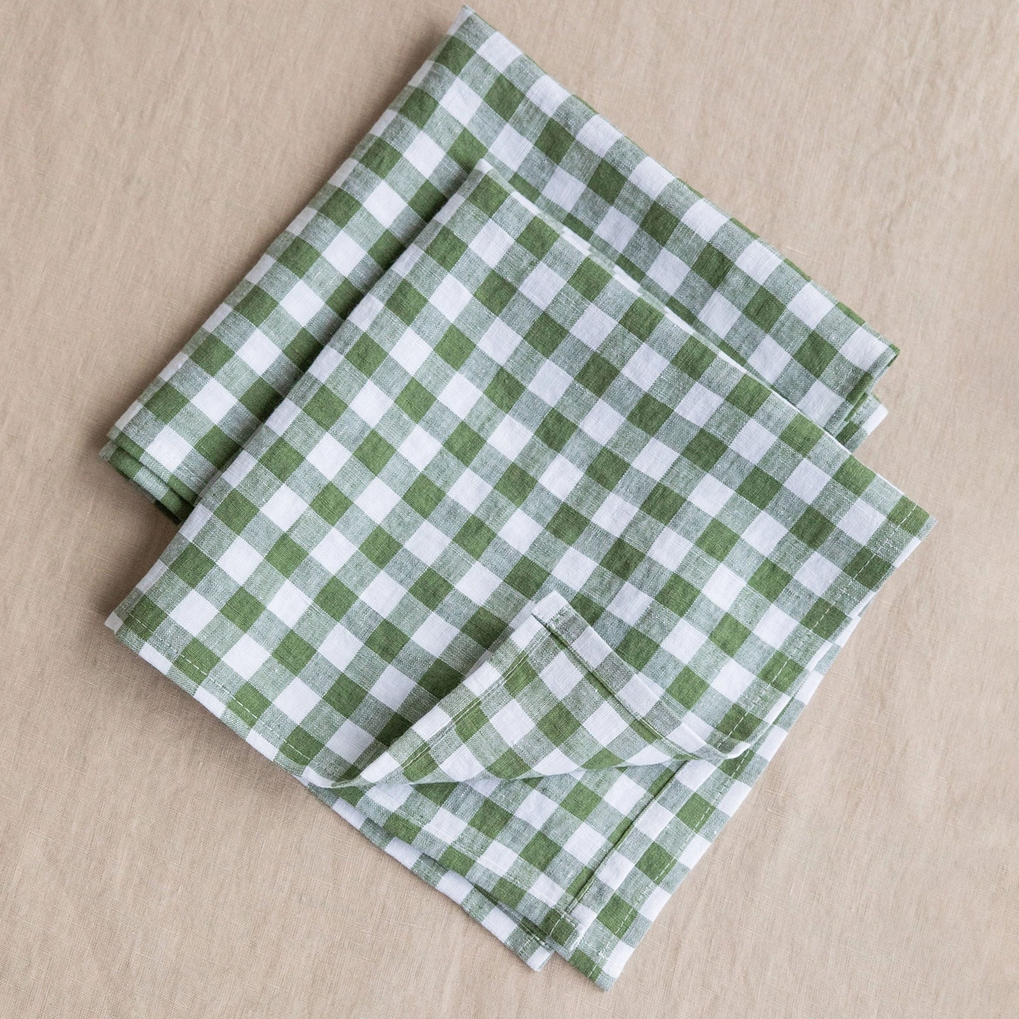 Linen Napkin Set in Forest Green Gingham on a wood surface - Addison West 