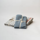 Stack of linen tablecloths wrapped with ribbon