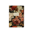 Notebook with muted floral bouquets pattern on the front on a white background