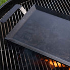 Close up of Made In Carbon Steel Griddle on a beige background at Addison West