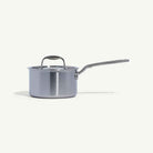 Made In Stainless Clad 2 qt. Saucepan with Lid on a beige background at Addison West