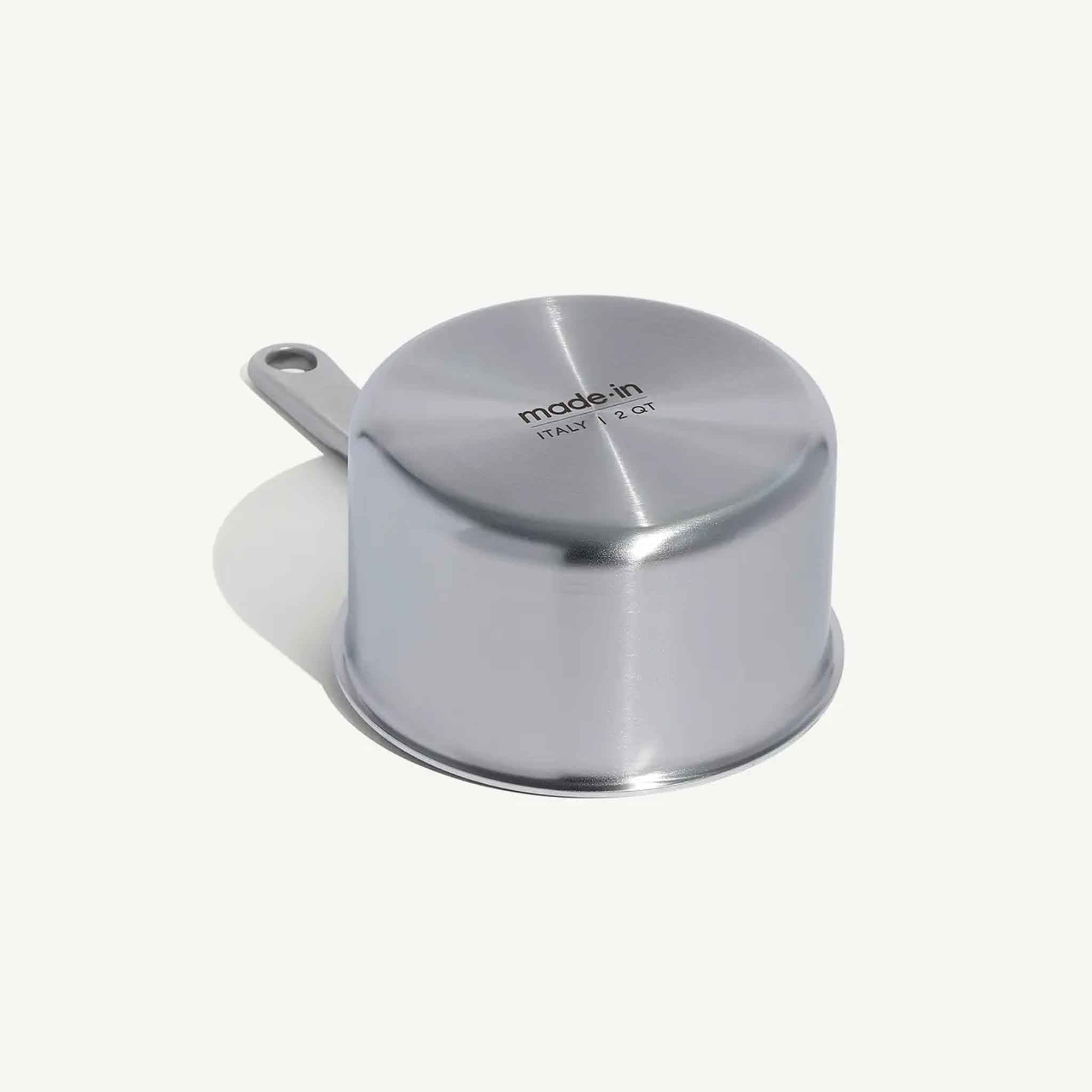 Bottom of Made In Stainless Clad 2 qt. Saucepan with Lid on a beige background at Addison West