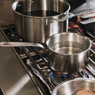 Made In Stainless Clad 2 qt. Saucepan with Lid on a stovetop at Addison West