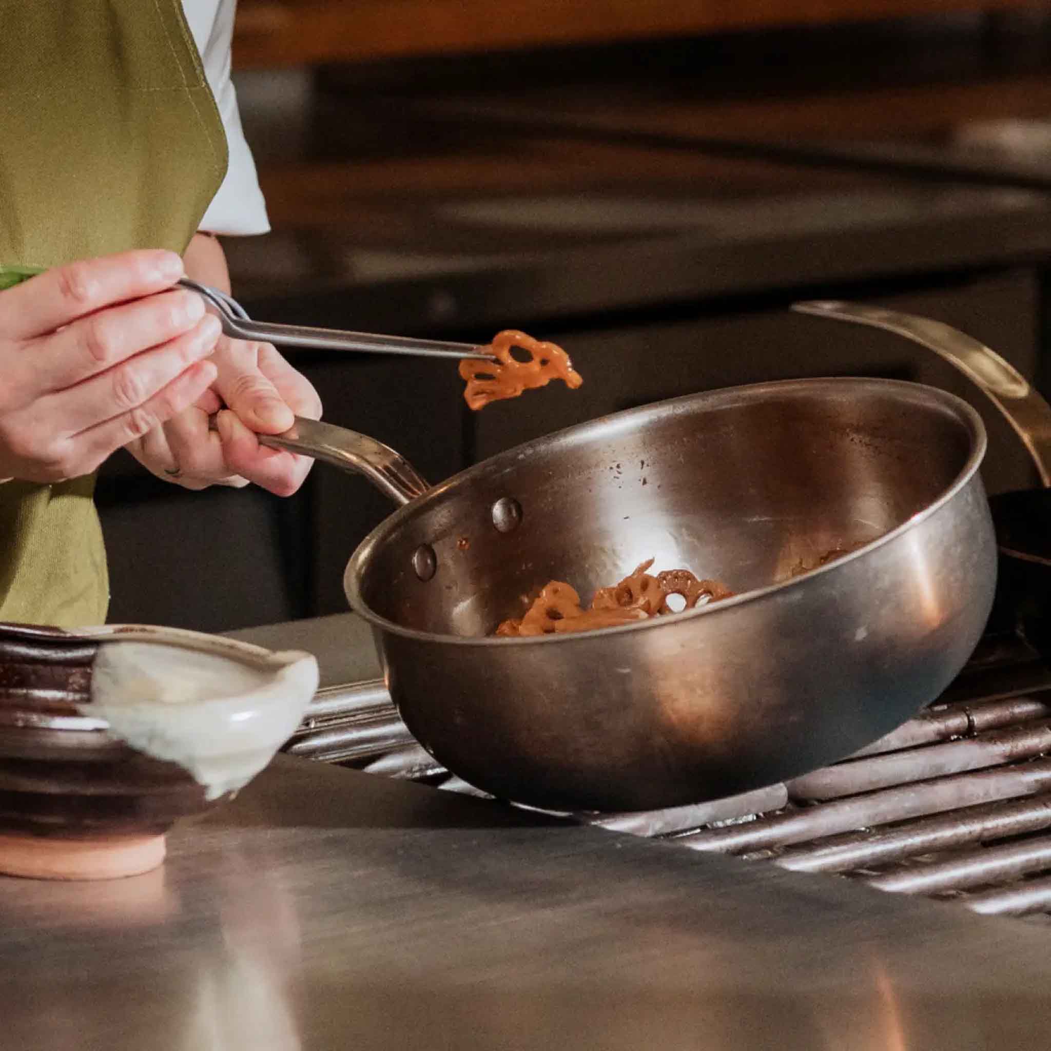 Made In Stainless Clad 3 qt. Saucepan with Lid on a stovetop at Addison West