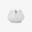 Hand carved white marble lotus on a white background