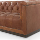 Four Hands furniture brand Maxx Chesterfield style Sofa in Heirloom Sienna leather on a white background