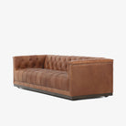 Four Hands furniture brand Maxx Chesterfield style Sofa in Heirloom Sienna leather on a white background