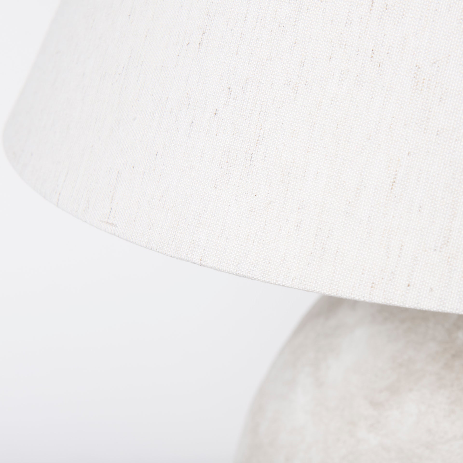 Close up of Mehdi Cream Ceramic Table Lamp on a white background