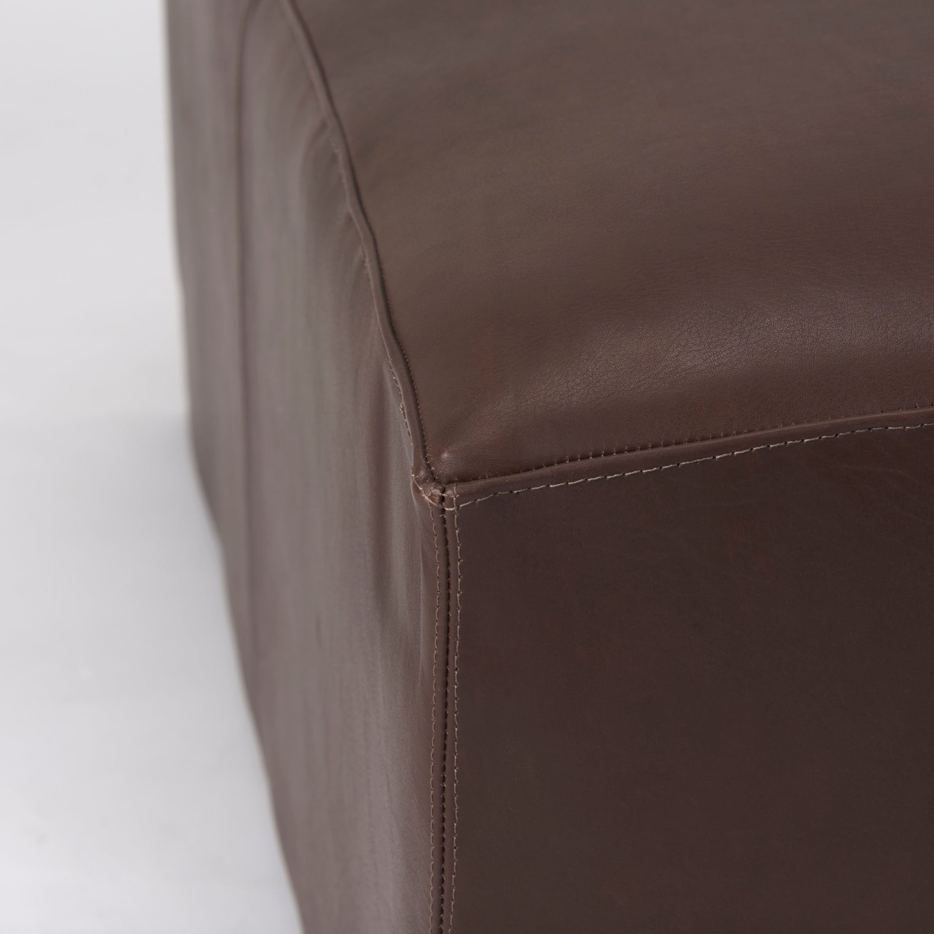 Minara 36L Square Dark Brown Leather Wrapped Ottoman on a white background