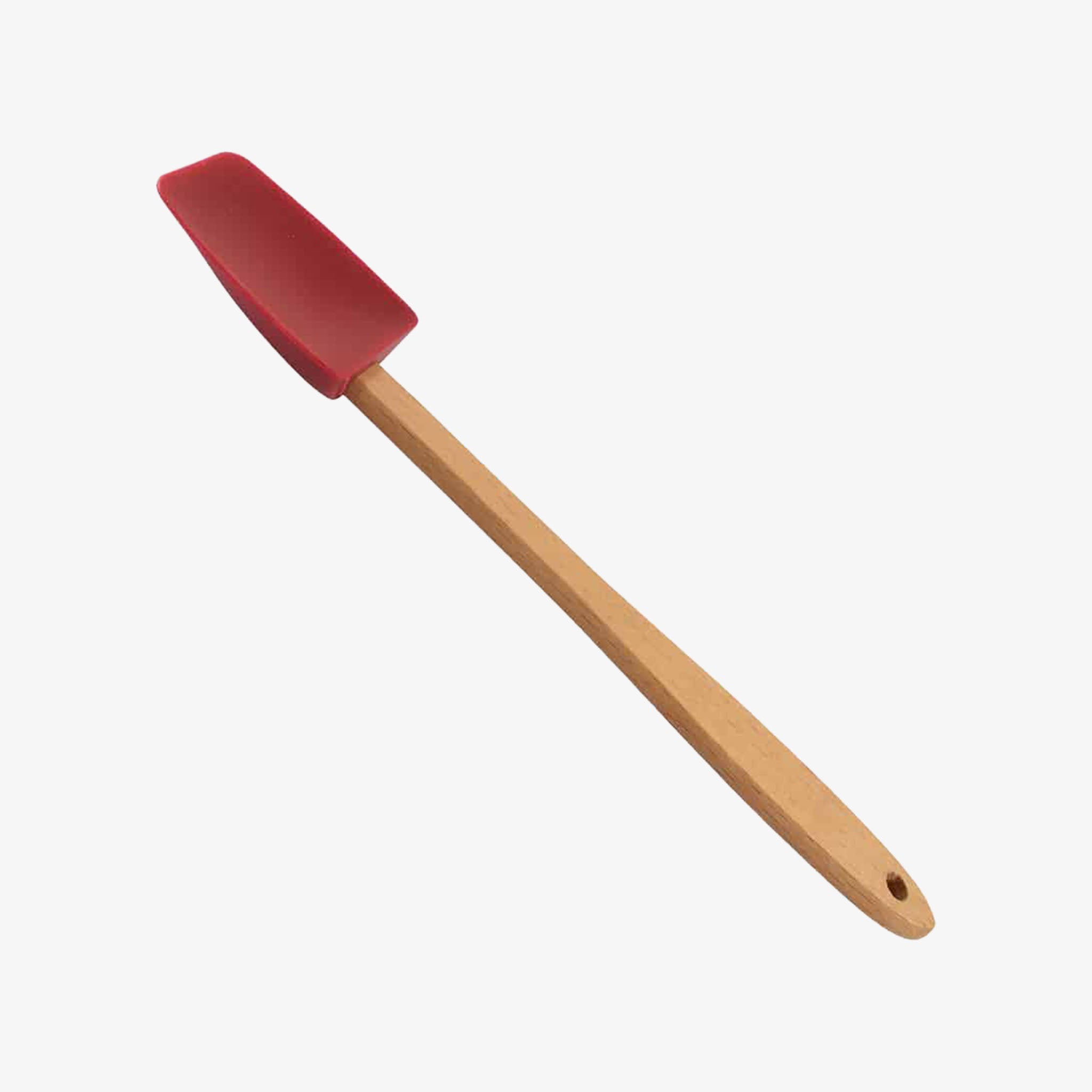 Small mini spatula with wood handle and red silicone on a white background