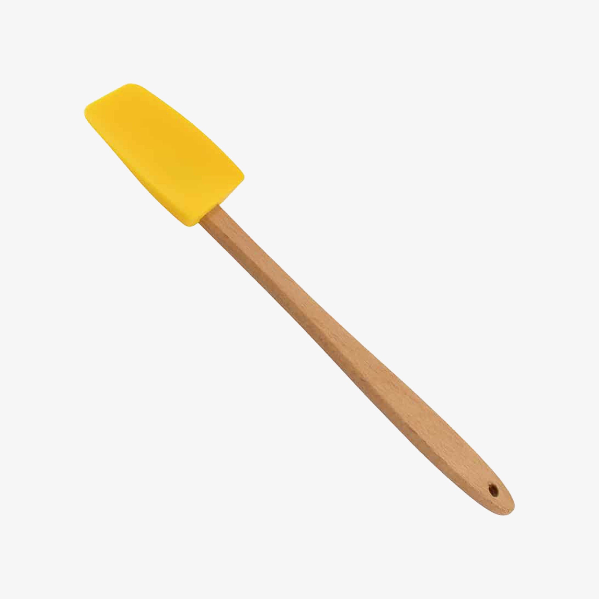 Small mini spatula with wood handle and yellow silicone on a white background