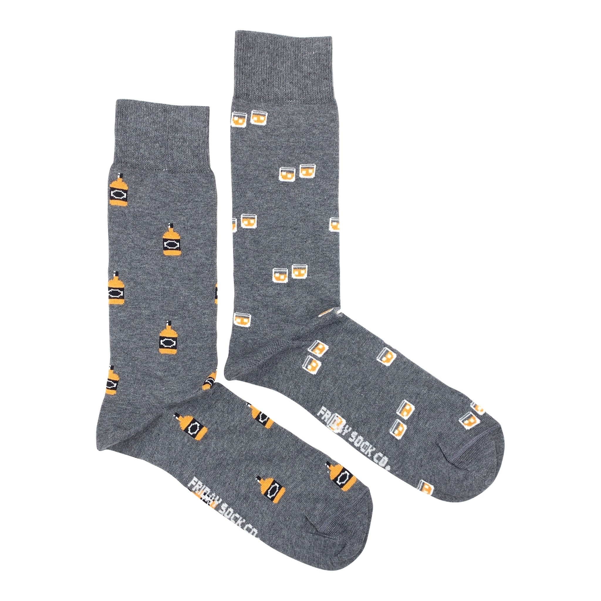 Mismatched Men's Socks with Whiskey & Rocks Glass on a white background