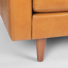 Close up of Olaf Tan Leather Sofa on a white background