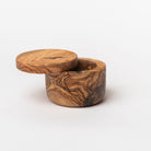 Olive wood salt cellar on a white background