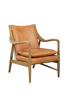 Furniture classics brown leather mid century chair low slung chair with hair on hide back on white background