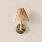 Delphine Sconce on a beige background