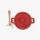 Red Ceramic Brie Baker with Holiday Tree Spoon on a white background