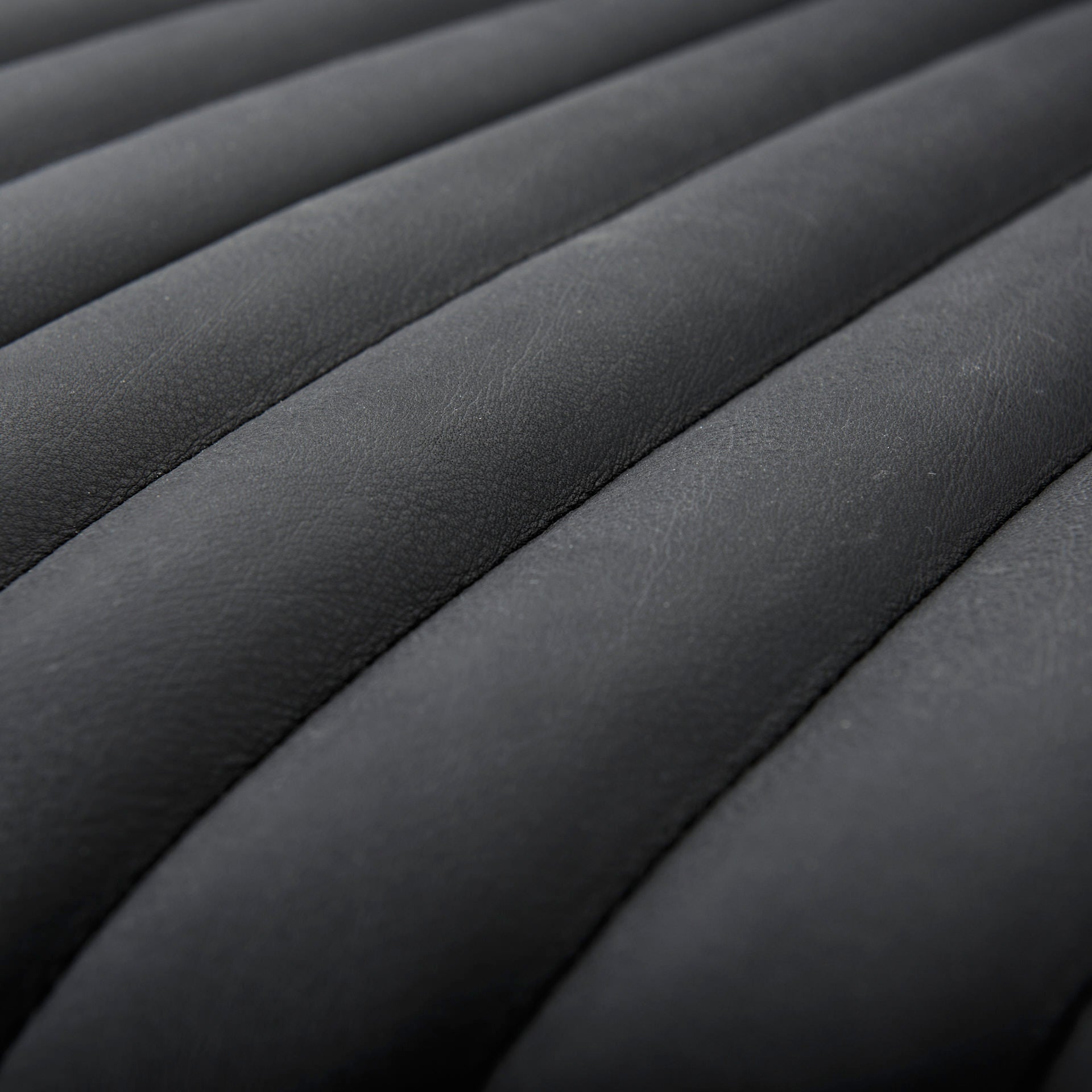 Close up of Ricciardo ribbed Black Leather Wrapped Three Seater Sofa