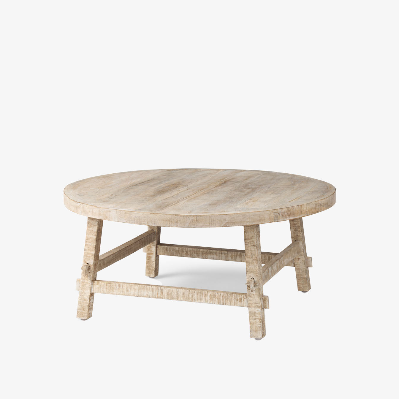 Whitewashed wood round coffee table with square dowel legs and bracing on a white background