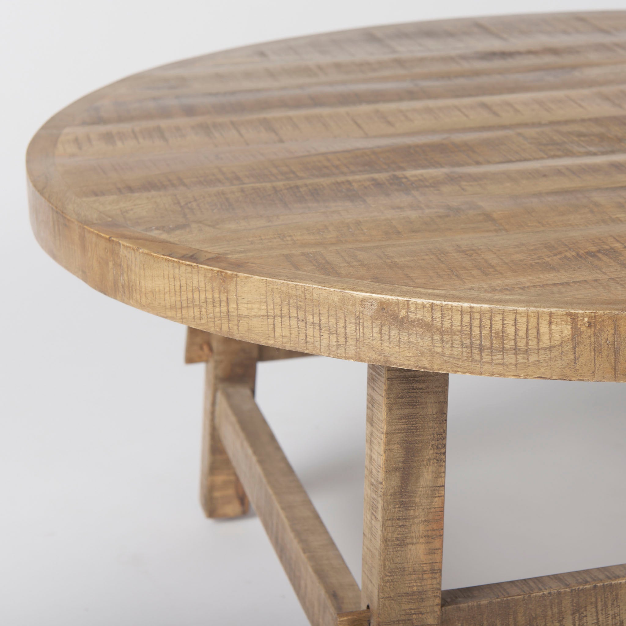 Honey stained wood round coffee table with square dowel legs and bracing on a white background