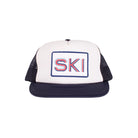 Trucker style hat with foam front and SKI patch on a ehite background