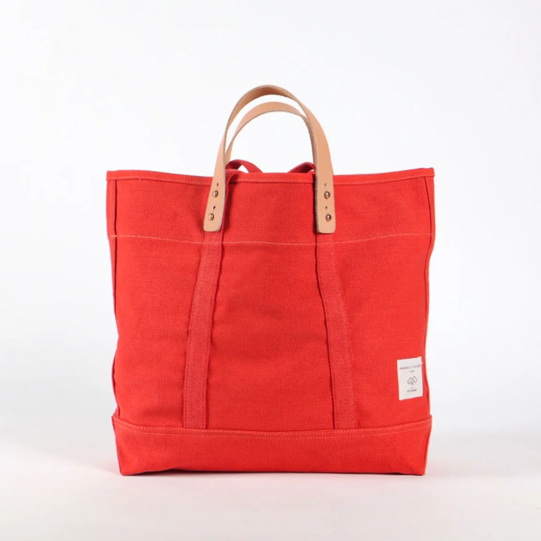 Immodest Cotton Small East-West Tote in Persimmon on a white background