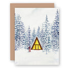 Greeting card with Snowy Cabin and A Frame on a white background