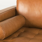 Close up of Svend Tan Leather Left Chaise Sectional Sofa on a white background