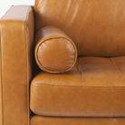 Close up of Svend Tan Leather Love Seat Sofa on a white background