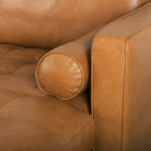 Close up of Svend Tan Leather Right Chaise Sectional Sofa on a white background