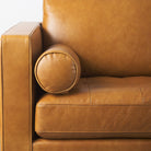 Close up of Svend Tan Leather Sofa on a white background