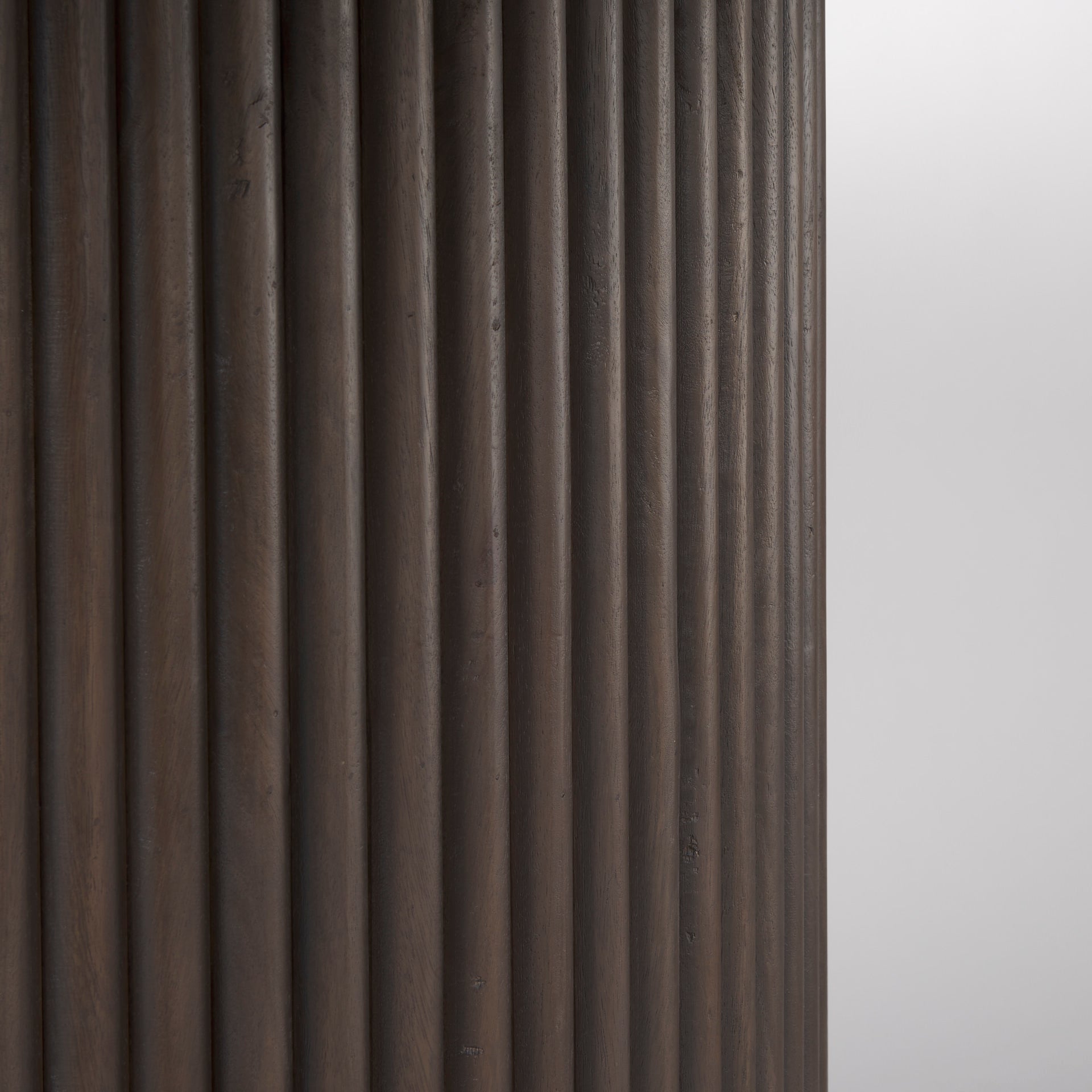 Close up of Terra Dark Brown Wood Round Fluted Dining Table on a white background