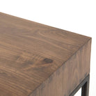 Close up of Trey Modular Writing Desk in Auburn Poplar on a white background